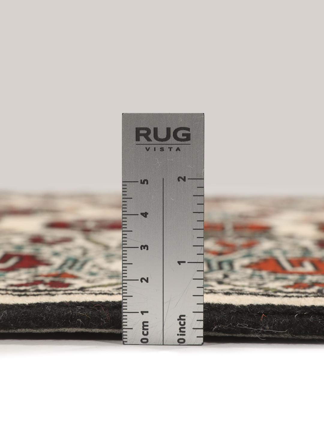 Hand-knotted Turkaman rug from the Middle East with a beige background and traditional geometric motifs.