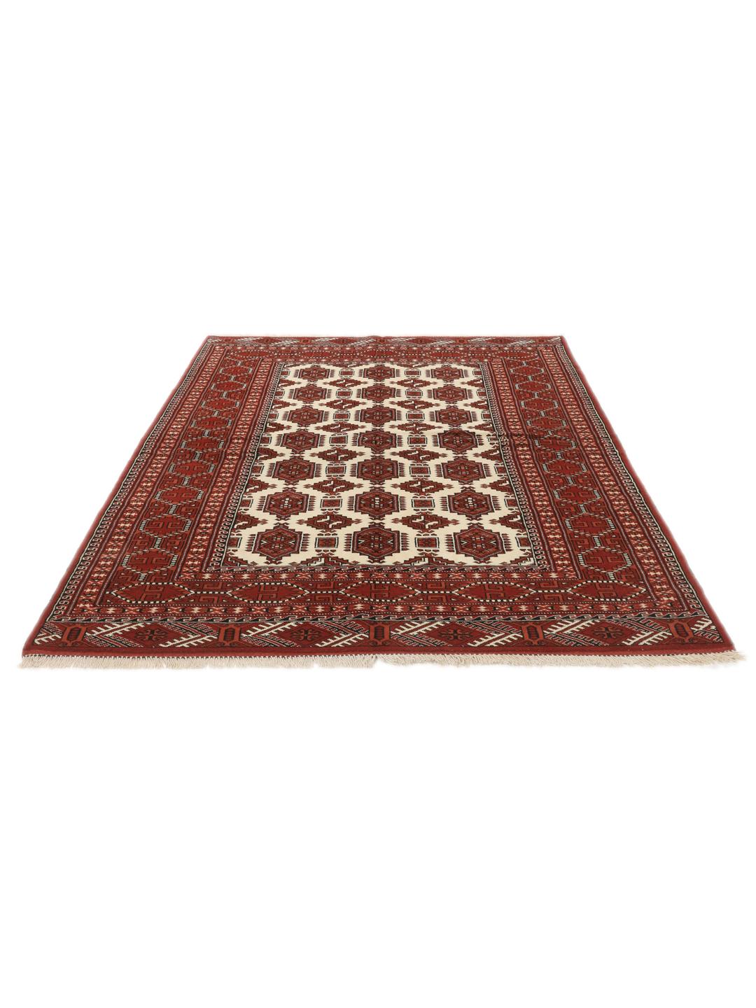 Hand-knotted Turkaman rug from the Middle East with a red and cream geometric design