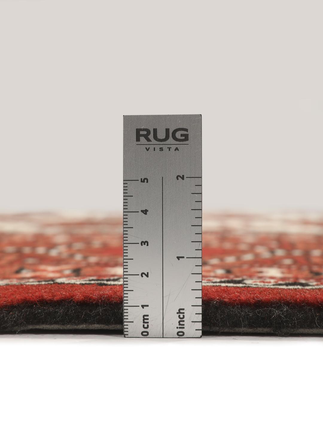 Hand-knotted Turkaman rug from the Middle East with a red and cream geometric design