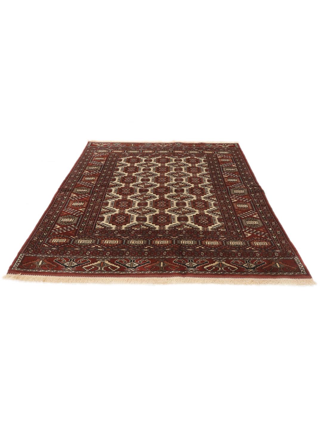 Hand-knotted Turkaman rug from the Middle East in red