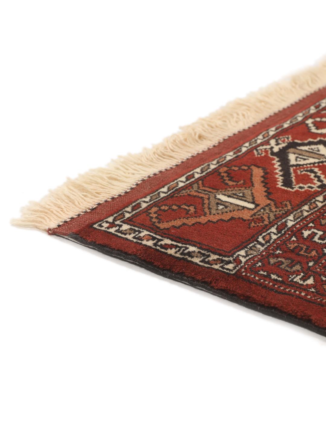 Hand-knotted Turkaman rug from the Middle East in red