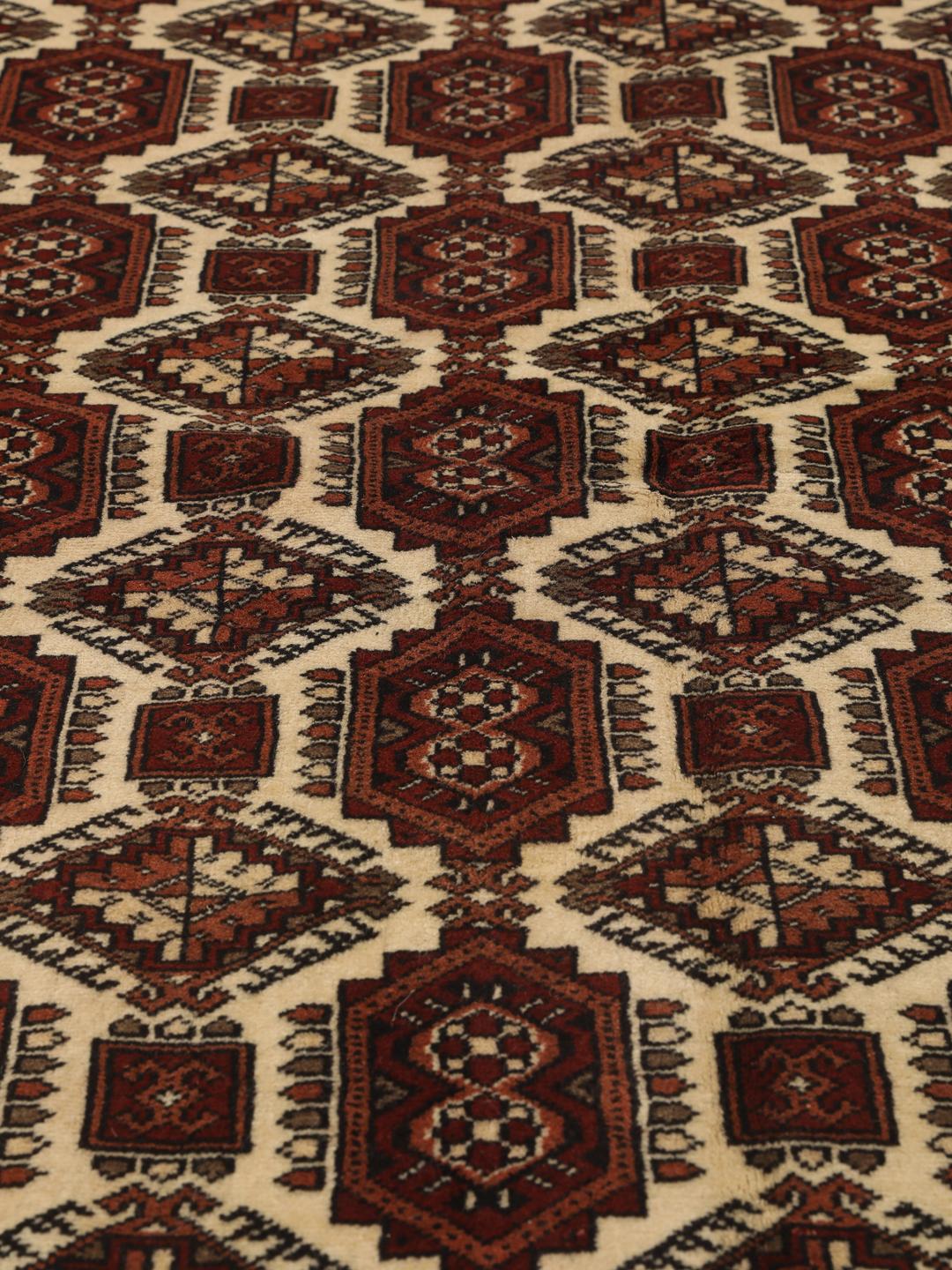 Hand-knotted Turkaman rug from the Middle East in red