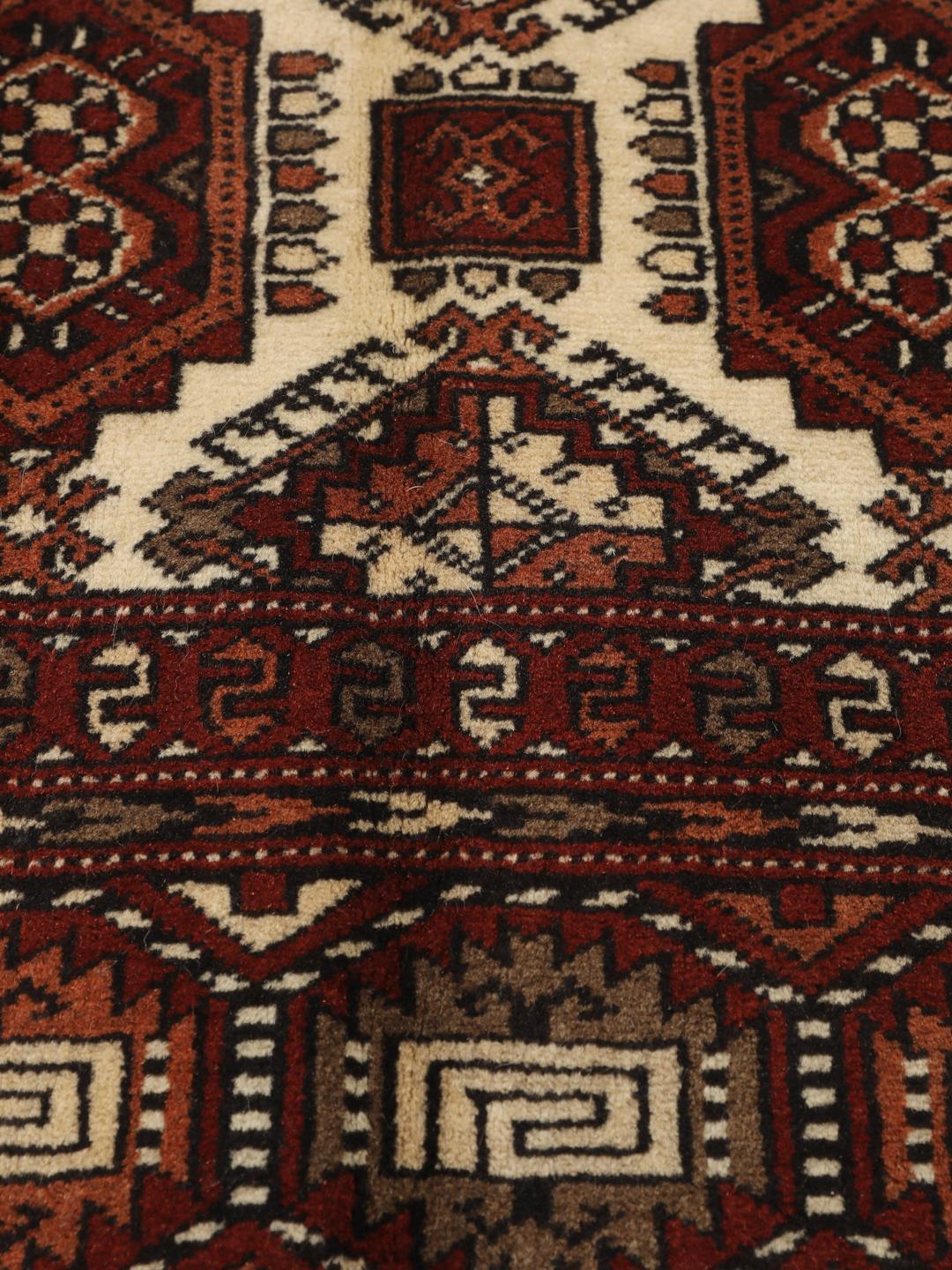 Hand-knotted Turkaman rug from the Middle East in red