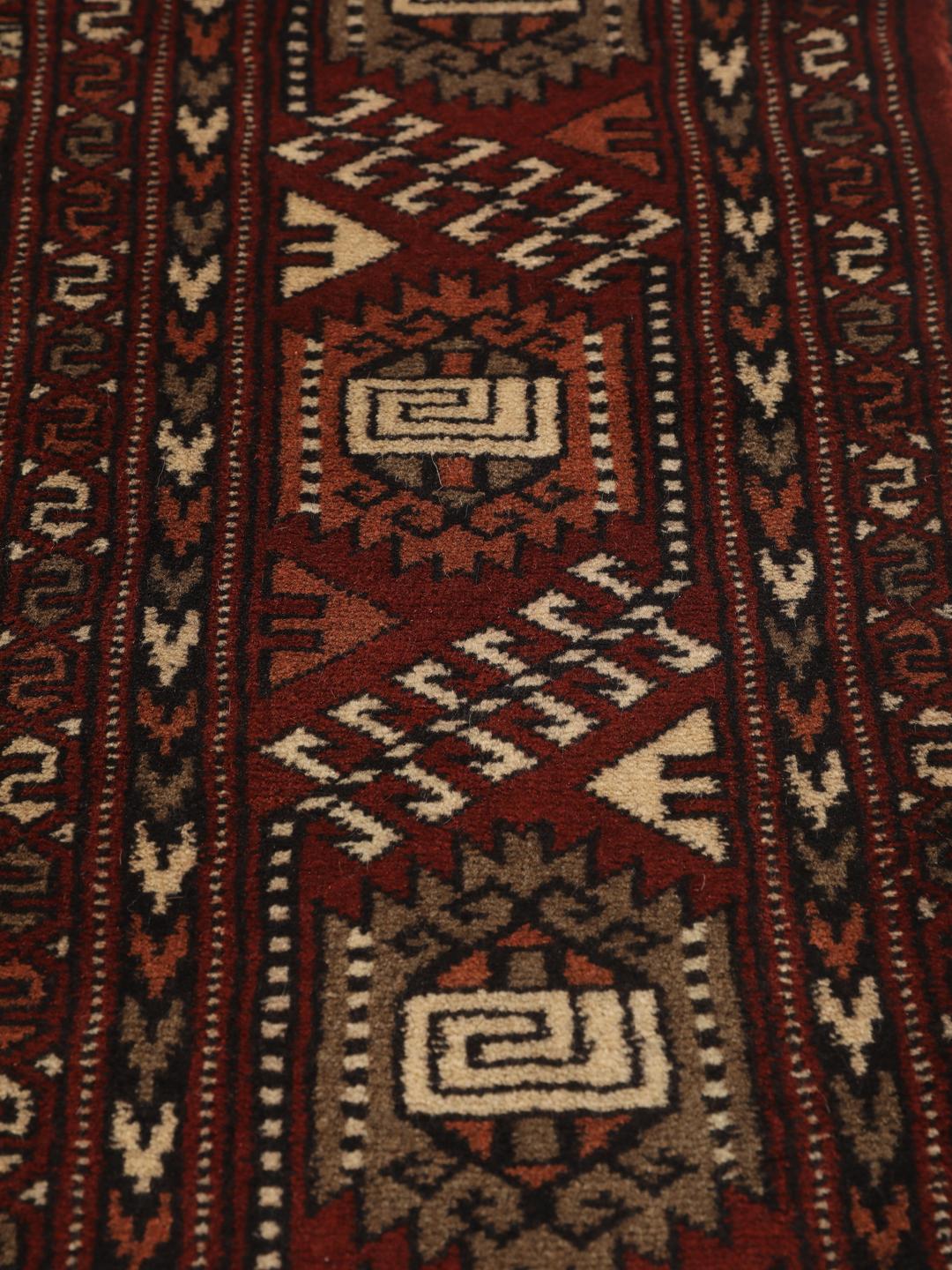 Hand-knotted Turkaman rug from the Middle East in red