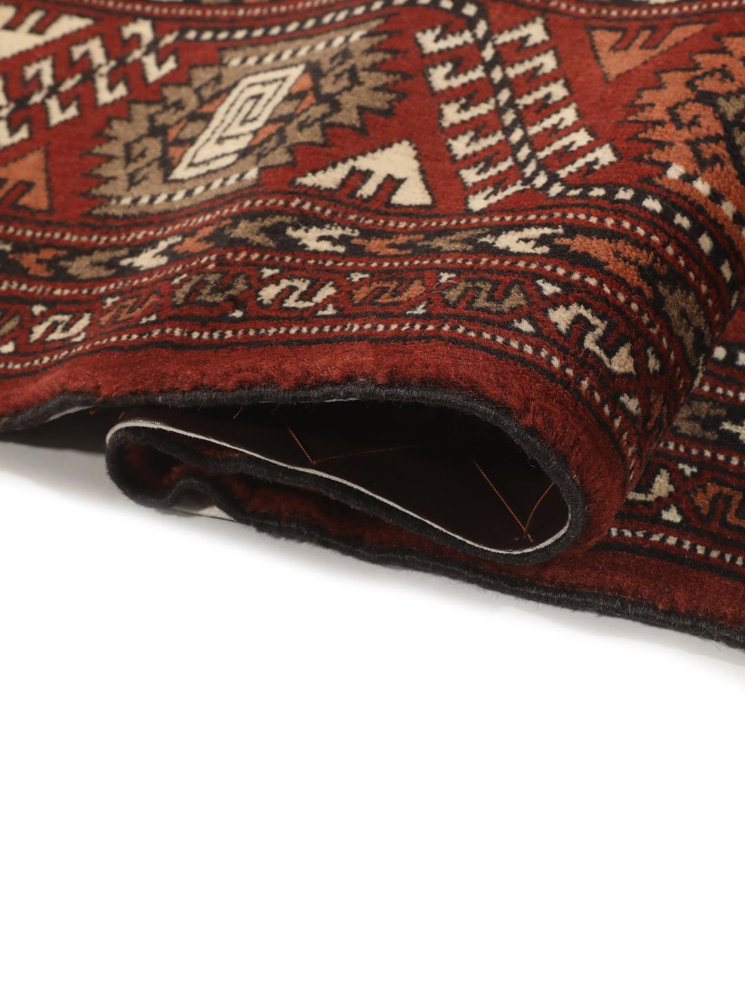 Hand-knotted Turkaman rug from the Middle East in red