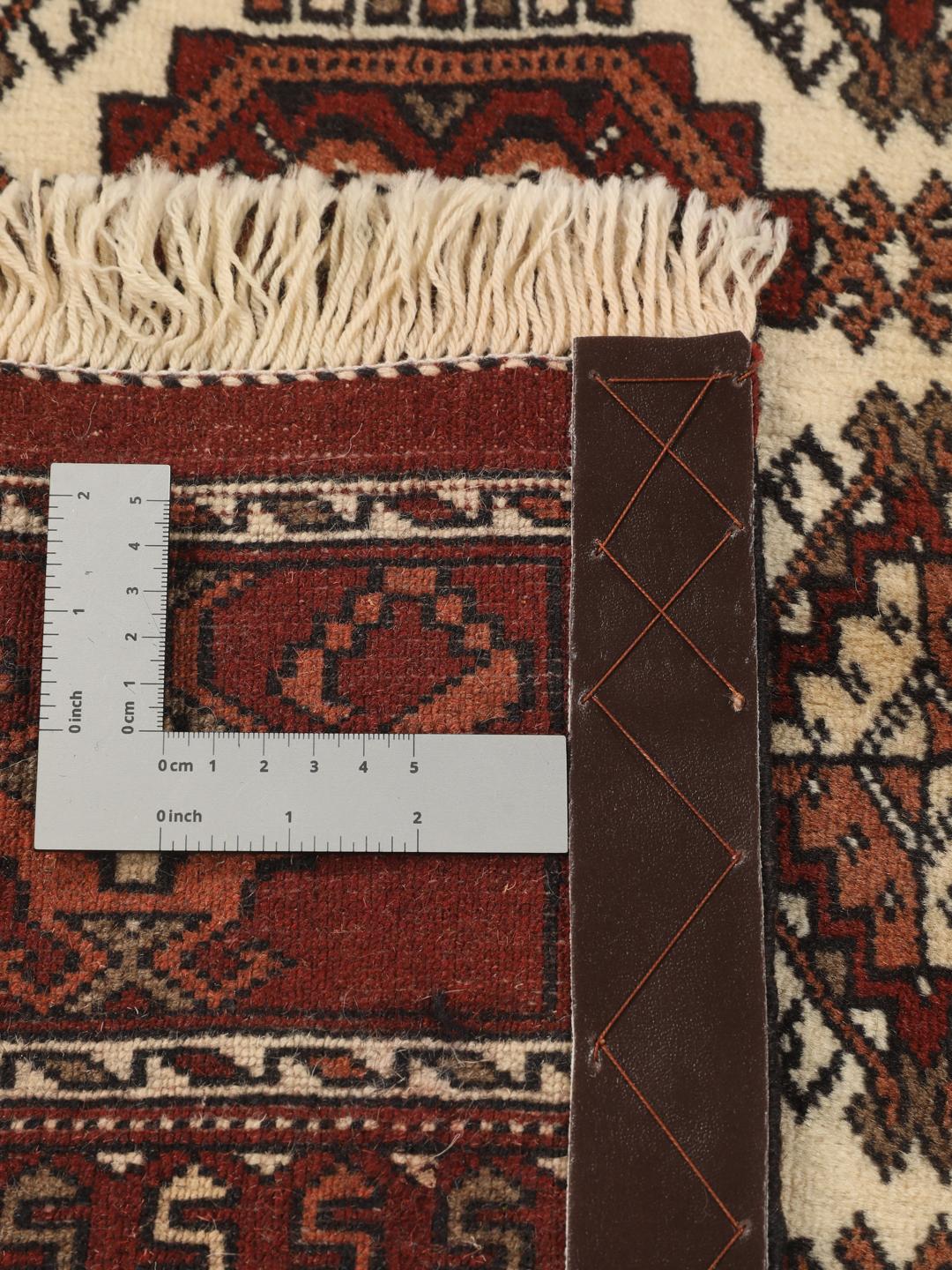 Hand-knotted Turkaman rug from the Middle East in red