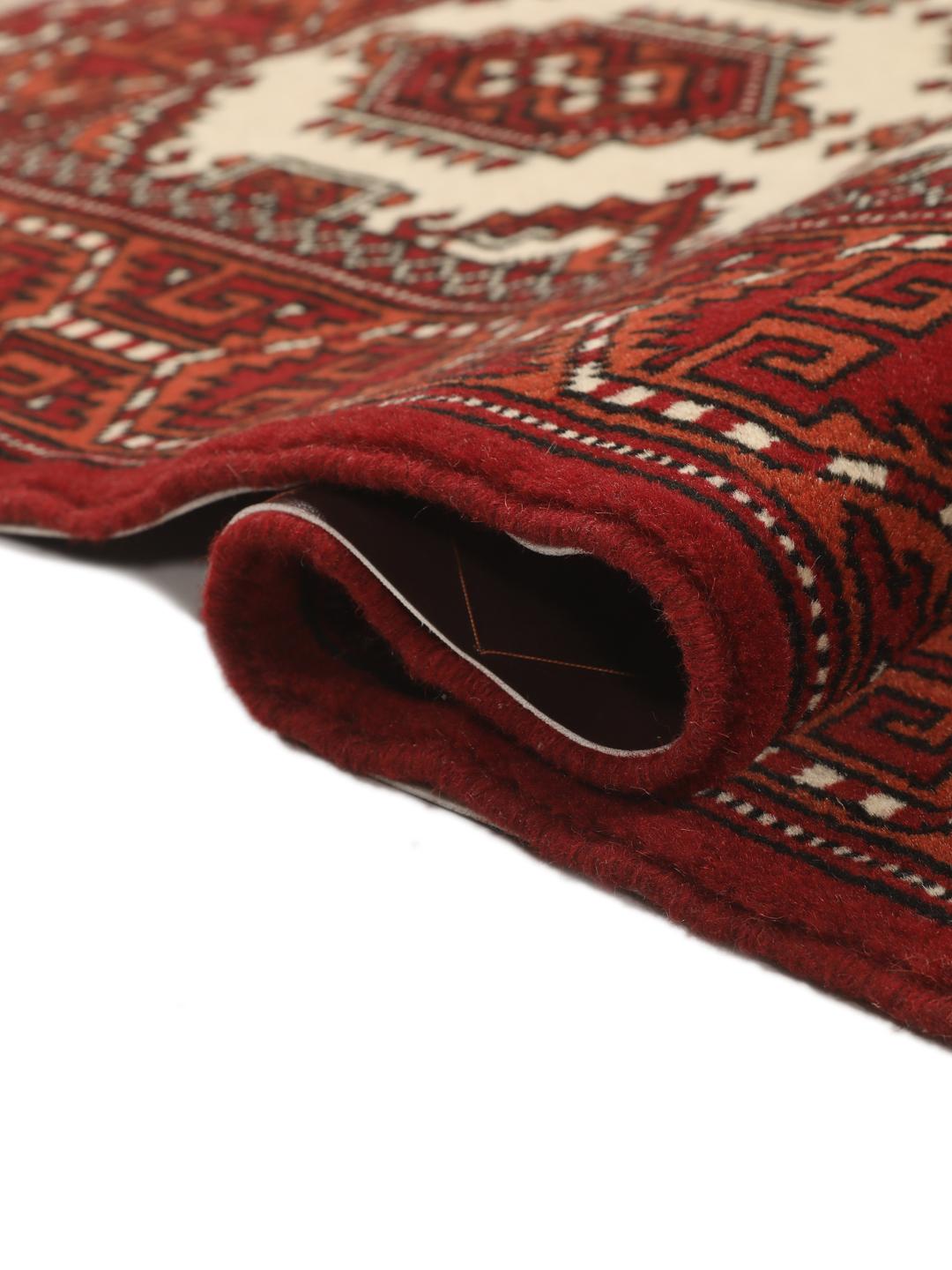 Hand-knotted Middle Eastern Turkaman rug in red and beige tones