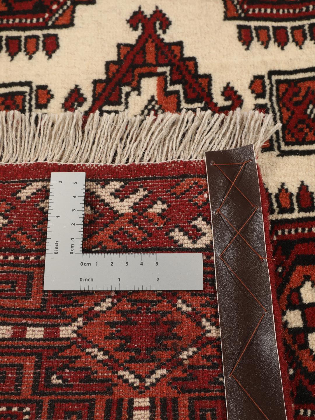 Hand-knotted Middle Eastern Turkaman rug in red and beige tones