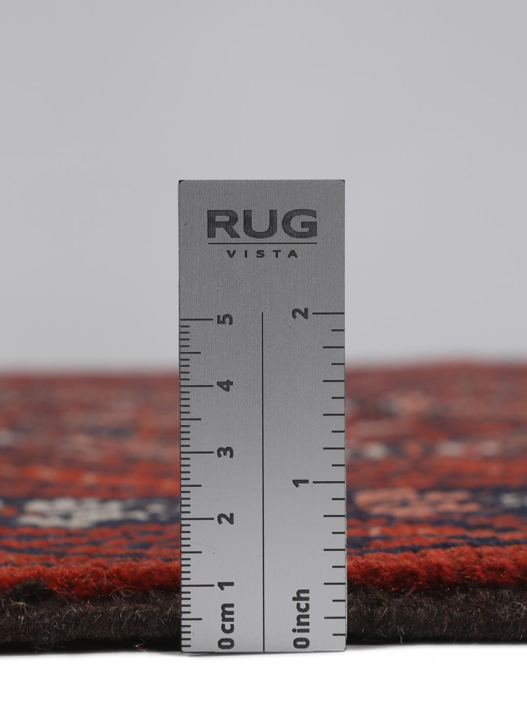 Håndknyttet mellemøstligt Baluch-tæppe med et mørkerødt geometrisk mønster