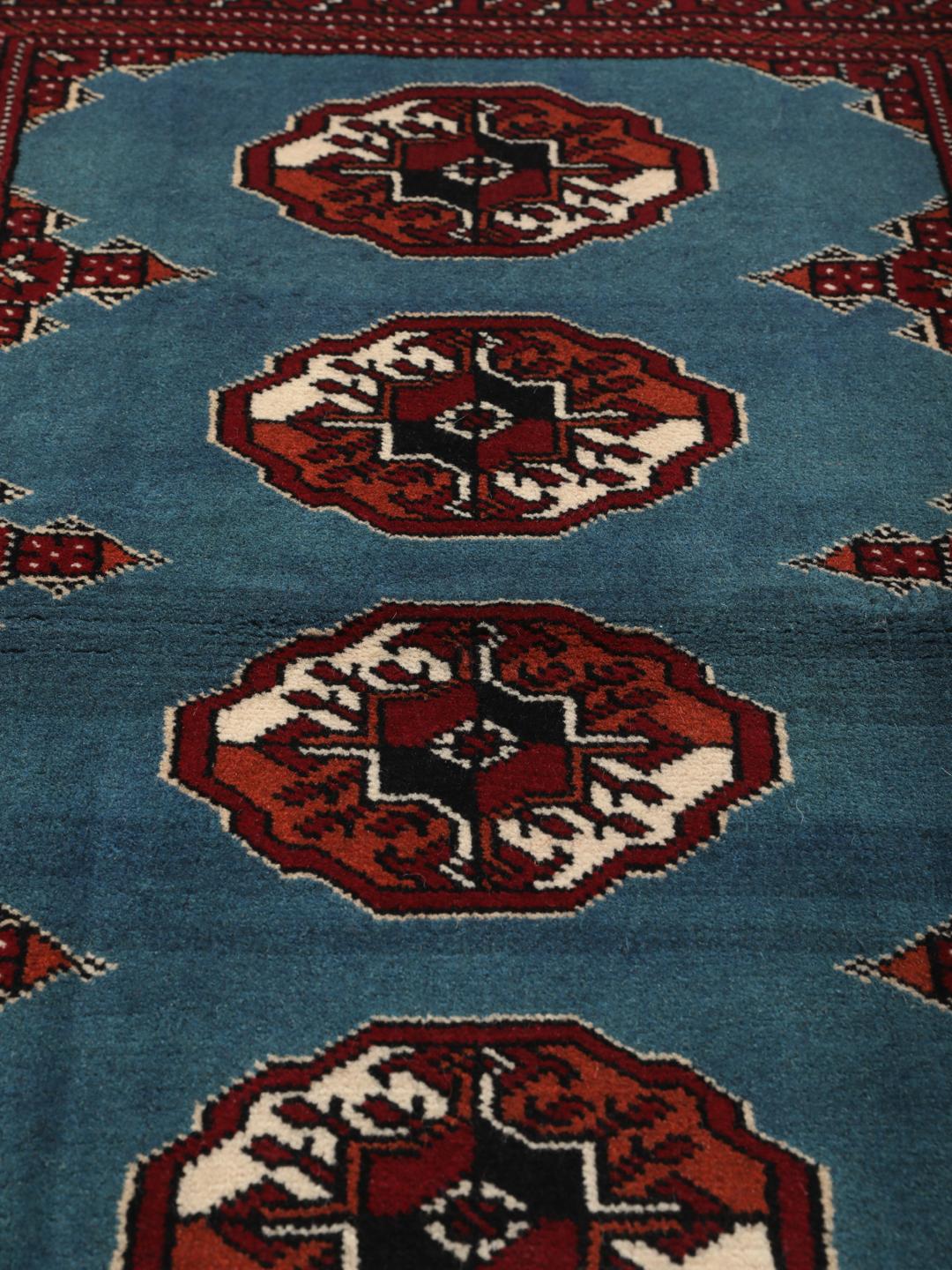 Hand-knotted Turkaman rug from the Middle East in blue and red