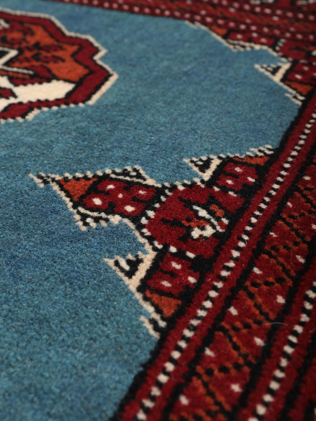 Hand-knotted Turkaman rug from the Middle East in blue and red
