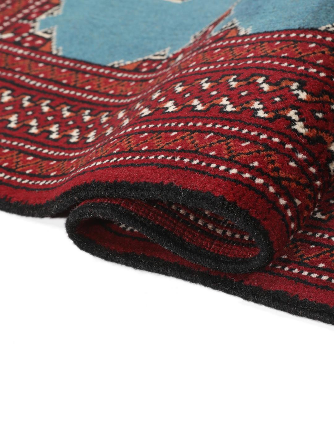 Hand-knotted Turkaman rug from the Middle East in blue and red