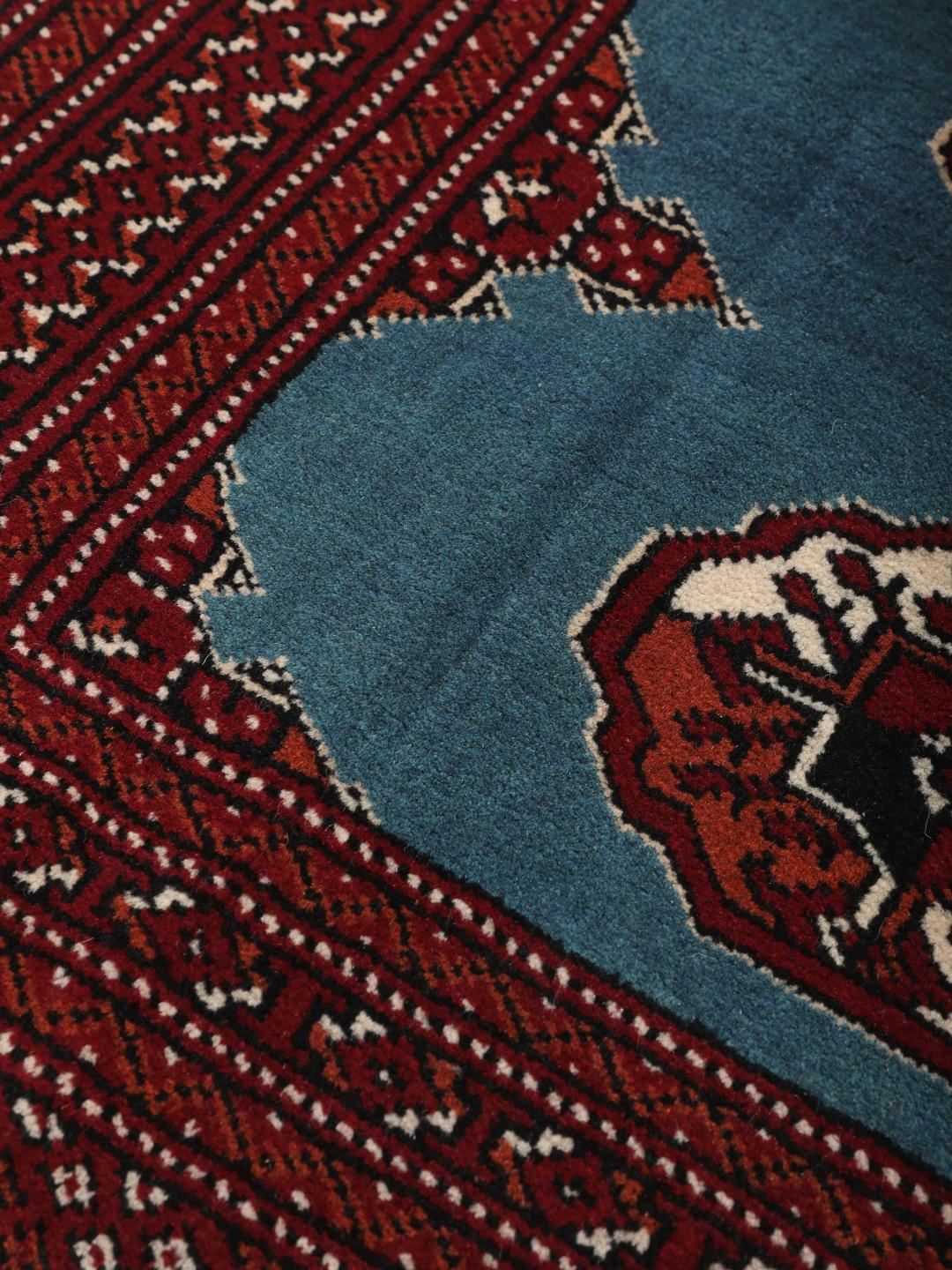 Hand-knotted Turkaman rug from the Middle East in blue and red
