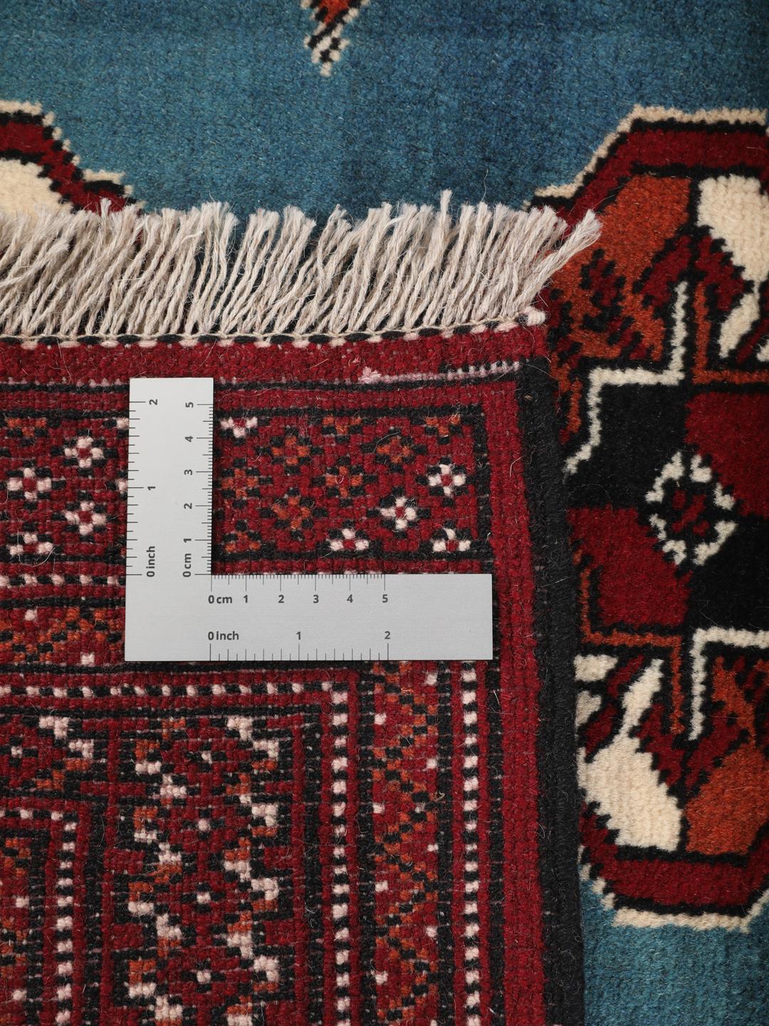 Hand-knotted Turkaman rug from the Middle East in blue and red