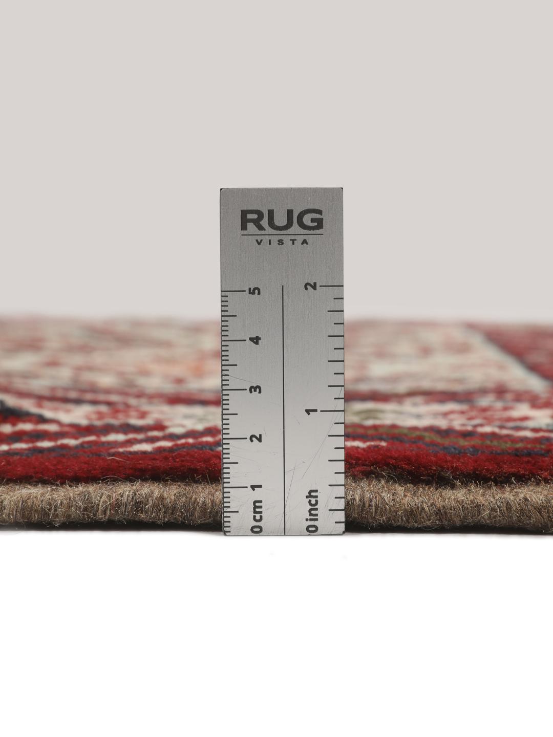 Hand-knotted Baluch rug with geometric motifs and red tones from the Middle East