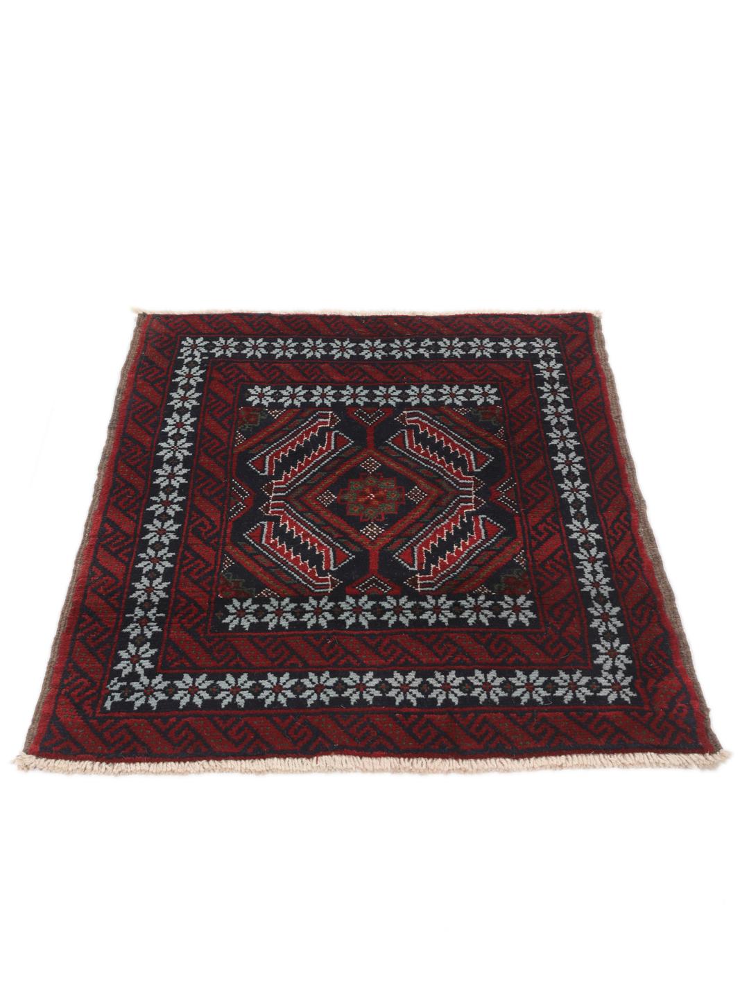 A hand-knotted Baluch rug from the Middle East featuring a dark-red and black geometric pattern.
