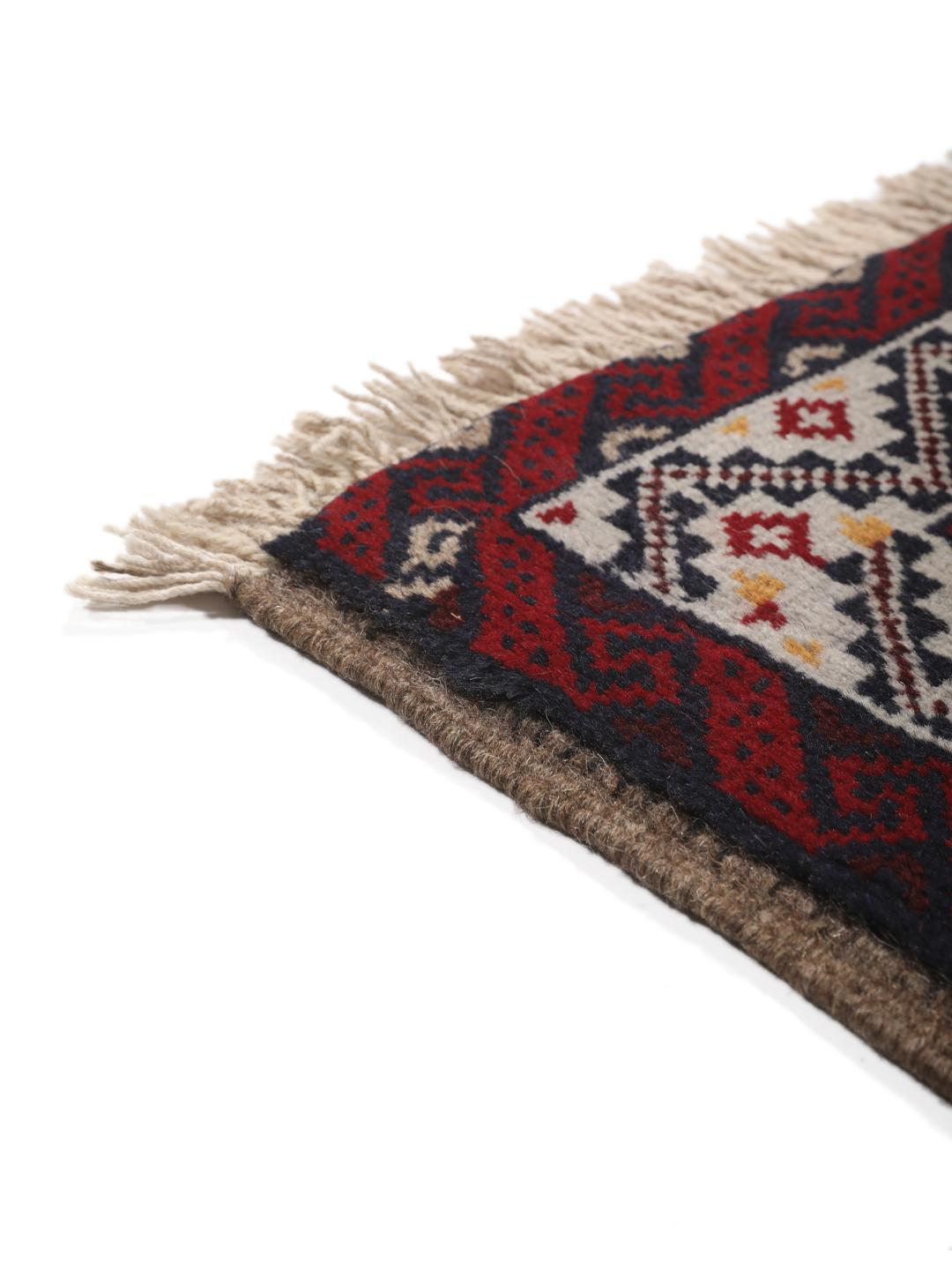 Hand-knotted Middle Eastern Baluch rug in red and beige tones
