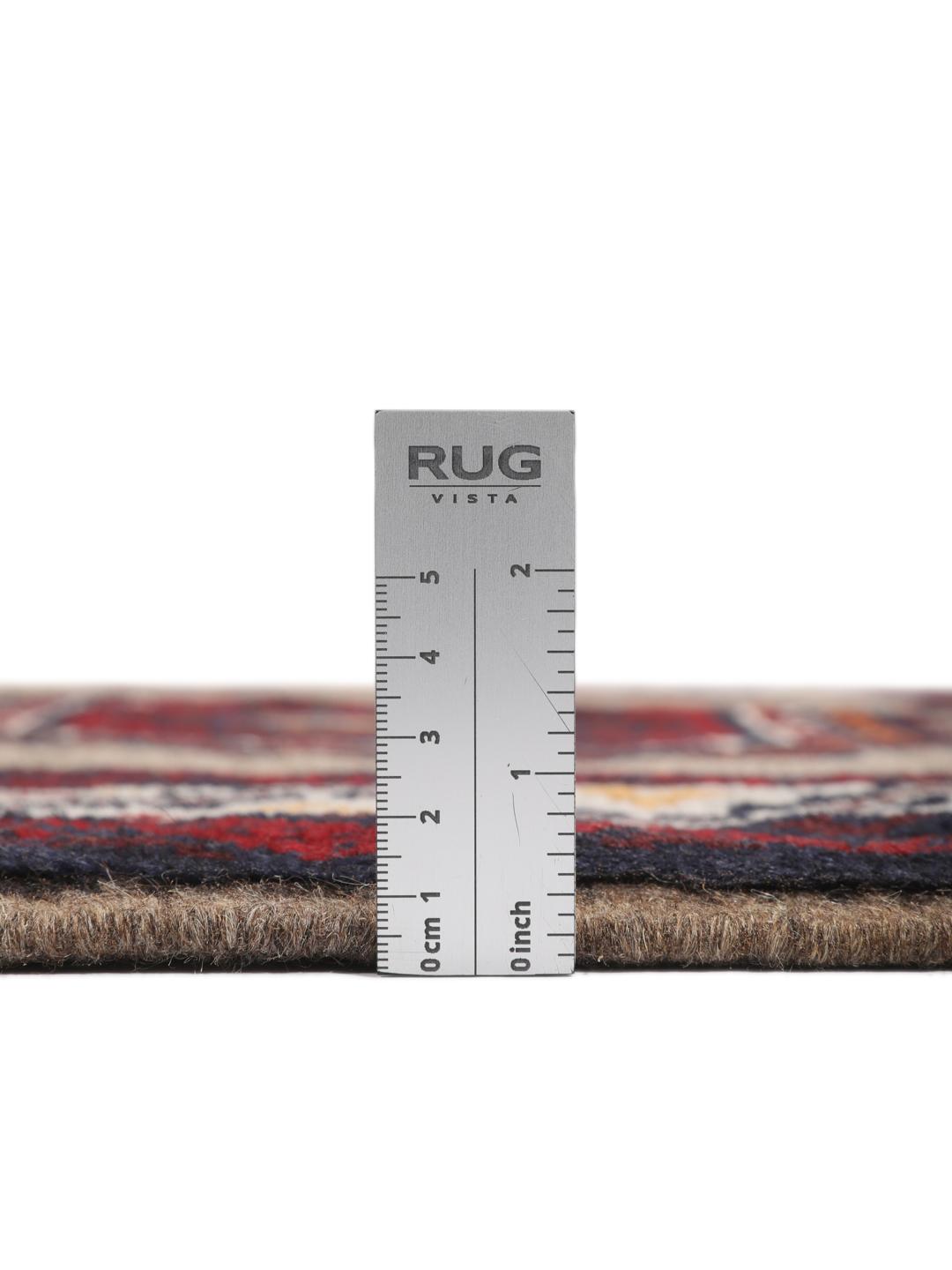 Hand-knotted Middle Eastern Baluch rug in red and beige tones