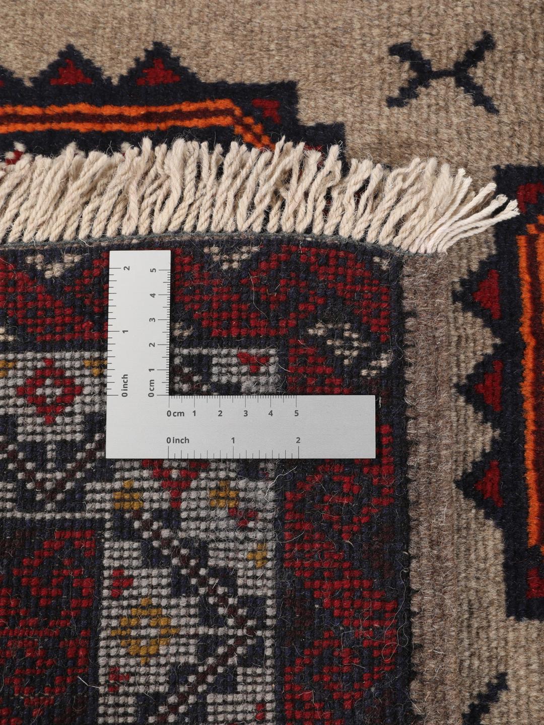 Hand-knotted Middle Eastern Baluch rug in red and beige tones