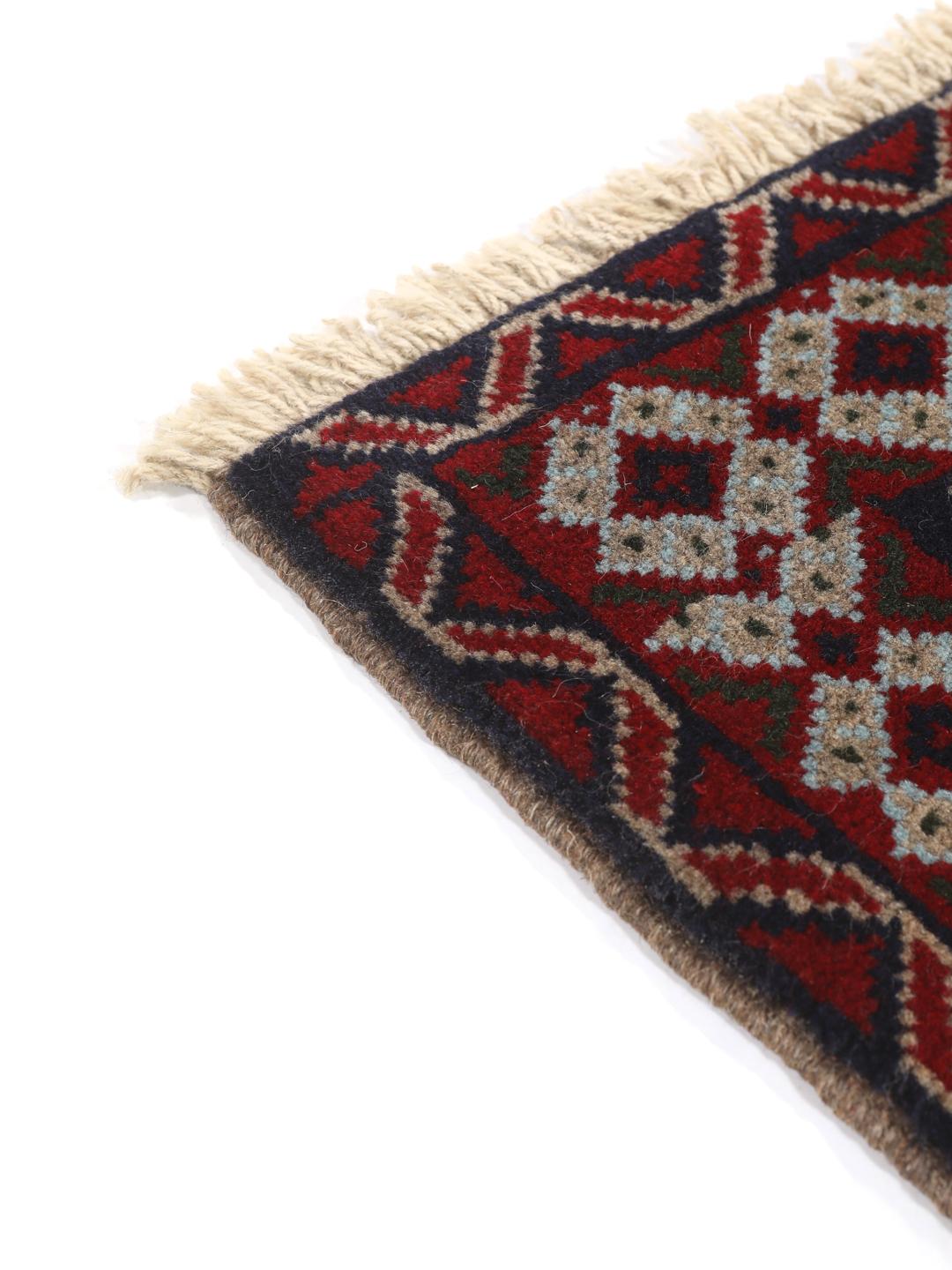 Håndknyttet Baluch-tæppe fra Mellemøsten i røde og beige nuancer