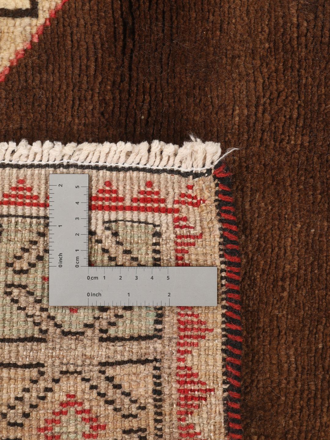 Håndknyttet Lori-tæppe fra Mellemøsten med beige bund og geometriske motiver.