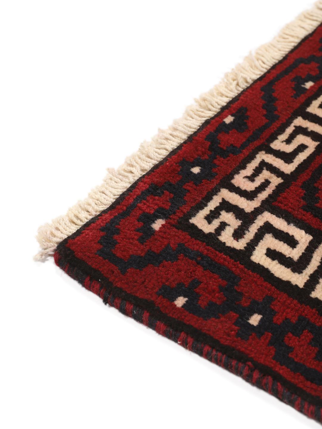 Hand-knotted Lori rug from the Middle East in dark red tones
