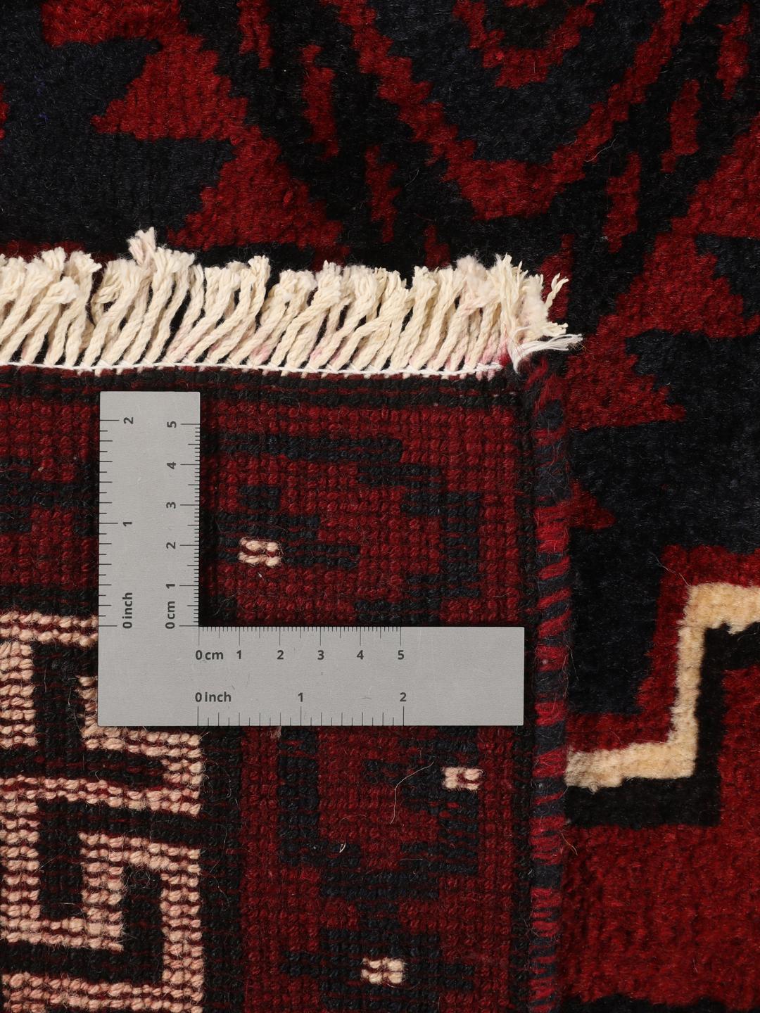 Hand-knotted Lori rug from the Middle East in dark red tones