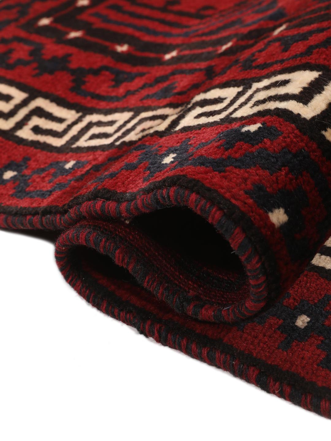 Hand-knotted Lori rug from the Middle East in dark red tones
