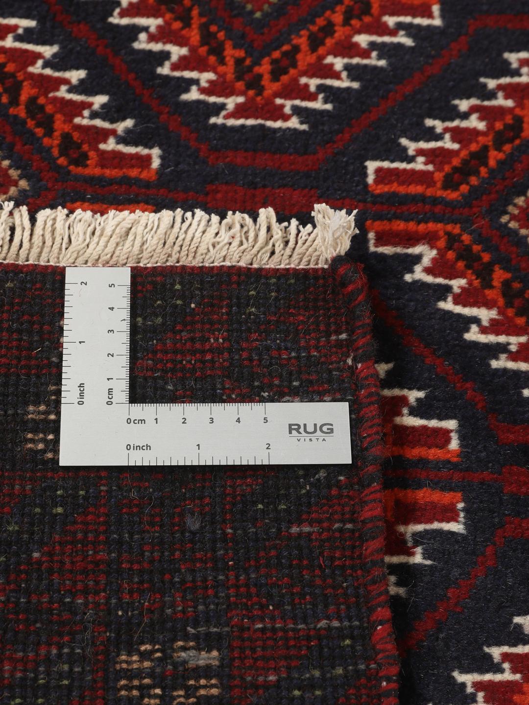 Handgeknoopt Beluch-tapijt in donkerrood met geometrische patronen