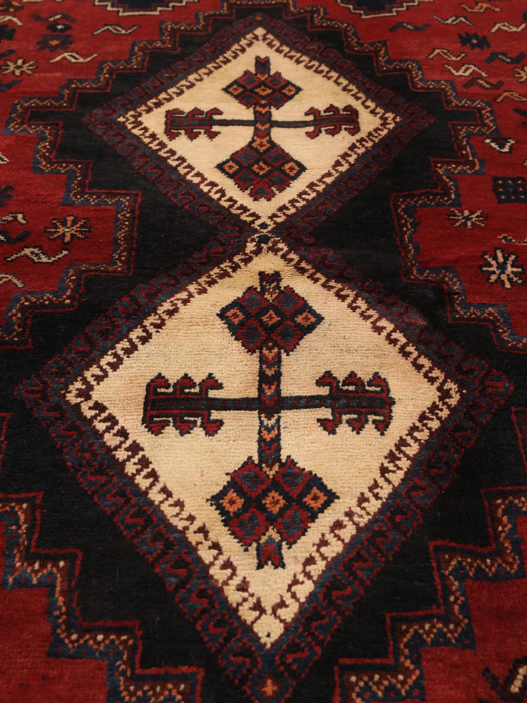 Hand-knotted Afshar rug from the Middle East in deep red and blue tones
