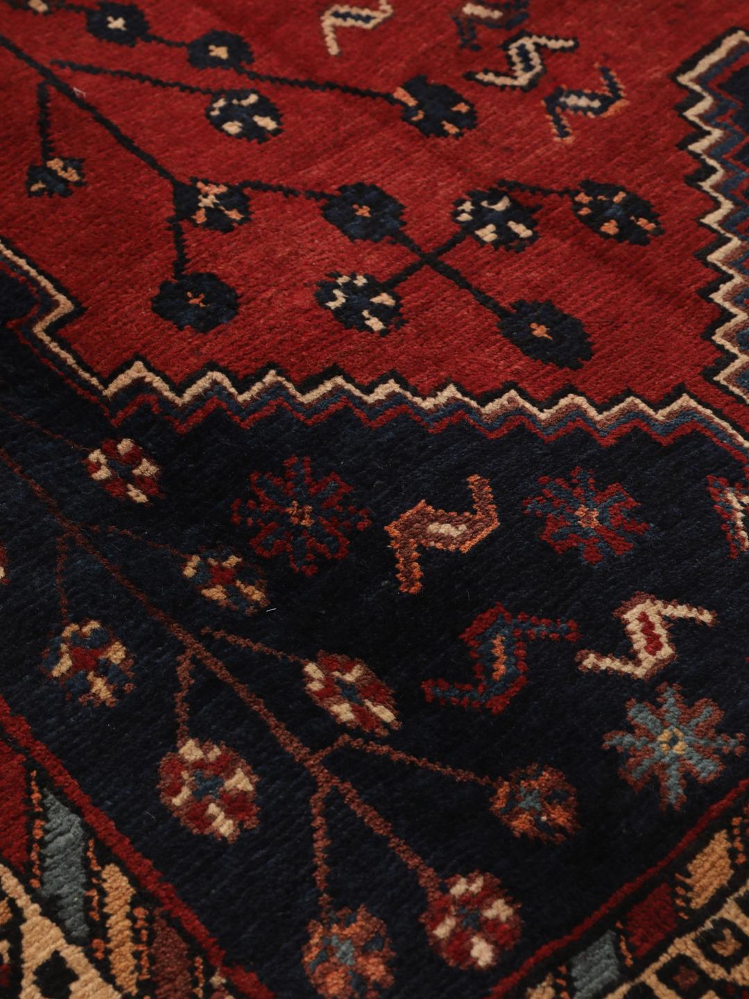 Hand-knotted Afshar rug from the Middle East in deep red and blue tones