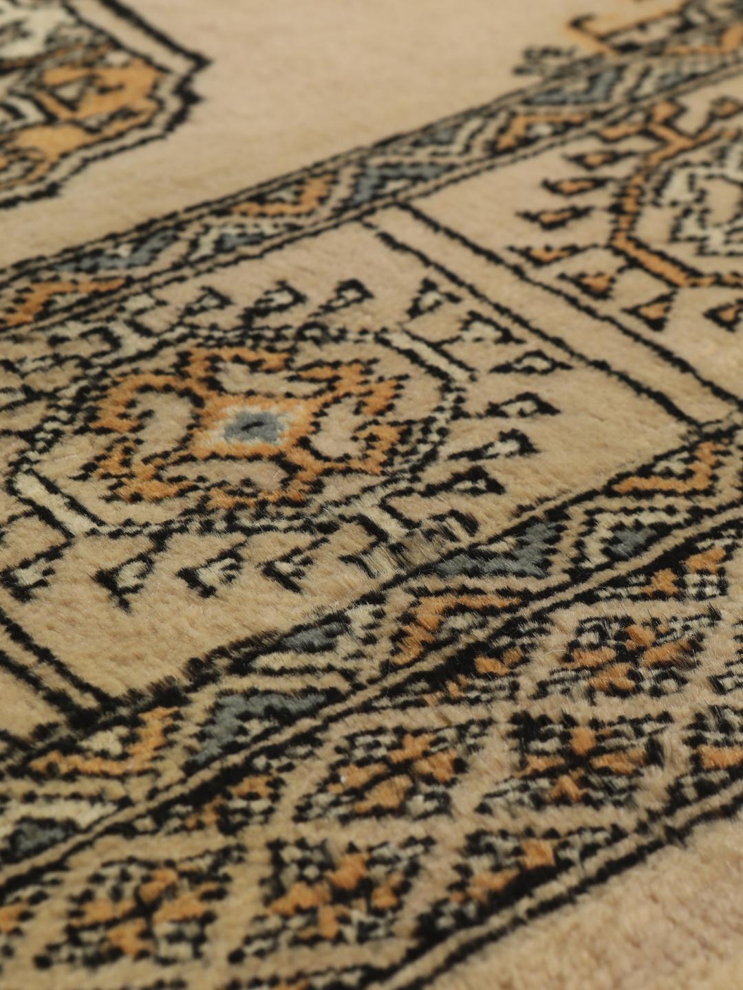 Hand-knotted Pakistan Bokhara rug with beige background and medallion patterns