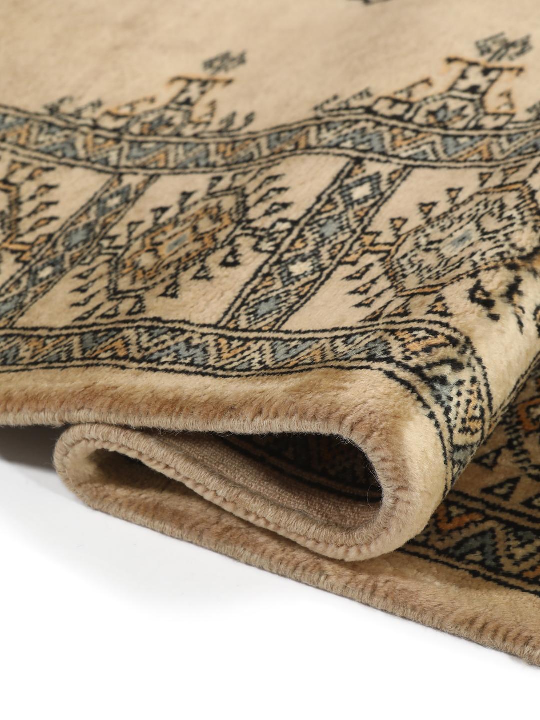 Hand-knotted Pakistan Bokhara rug with beige background and medallion patterns