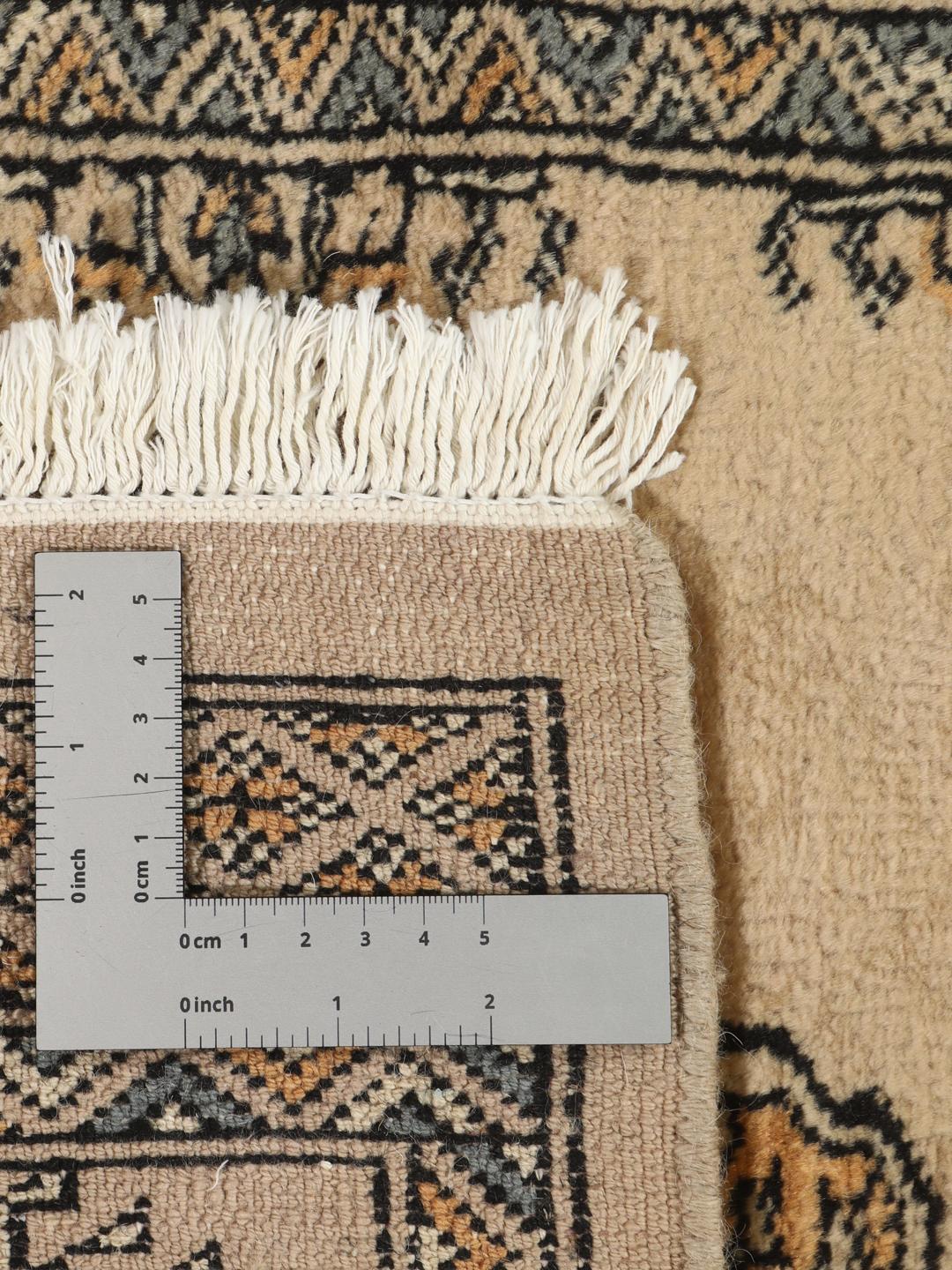 Hand-knotted Pakistan Bokhara rug with beige background and medallion patterns
