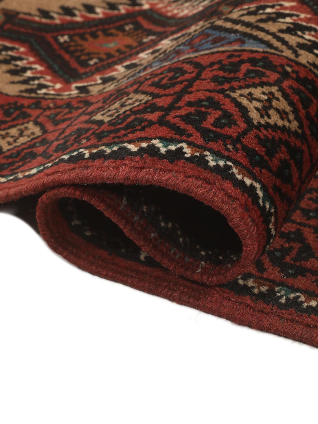 Hand-knotted Beluch rug from the Middle East in dark-red and beige
