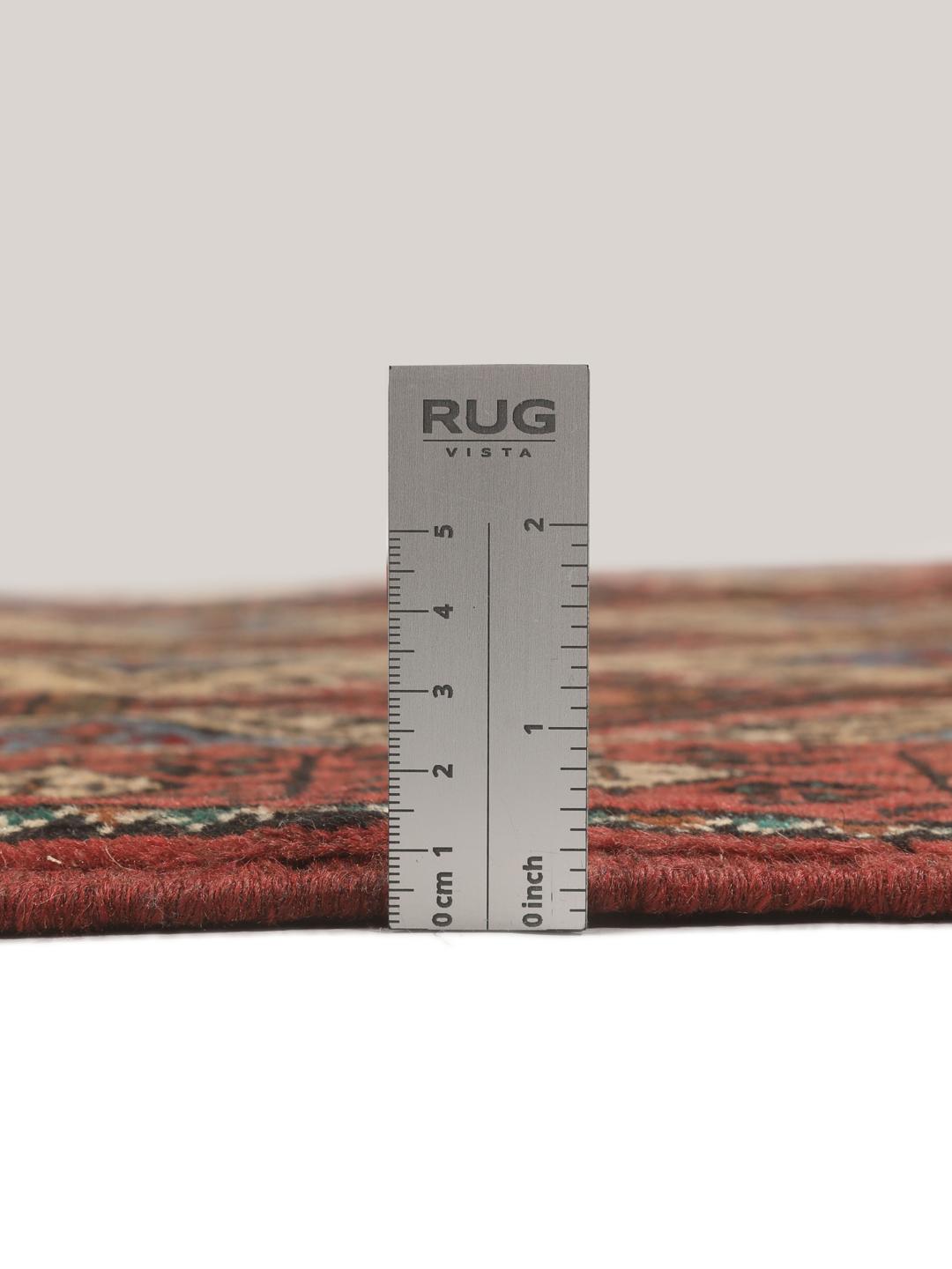 Hand-knotted Beluch rug from the Middle East in dark-red and beige