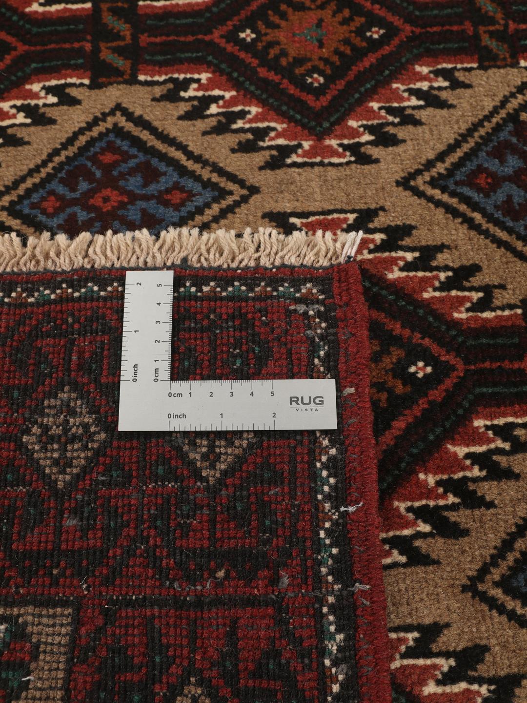 Hand-knotted Beluch rug from the Middle East in dark-red and beige