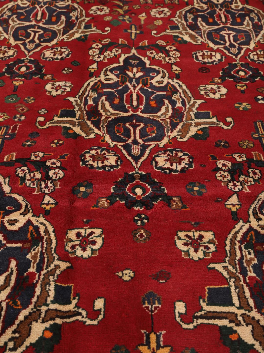 Hand-knotted red Afshar rug with traditional geometric motifs from the Middle East