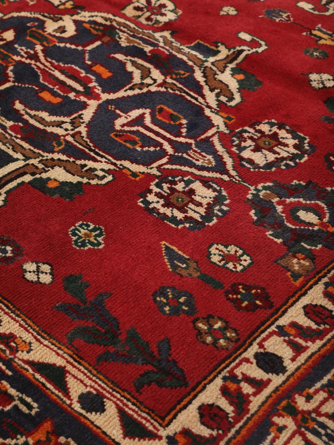 Hand-knotted red Afshar rug with traditional geometric motifs from the Middle East