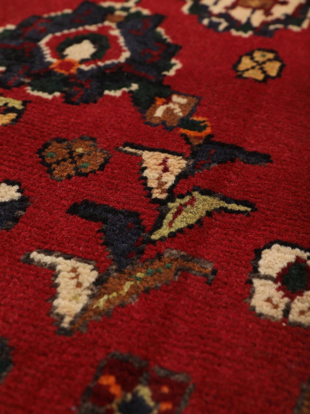 Hand-knotted red Afshar rug with traditional geometric motifs from the Middle East