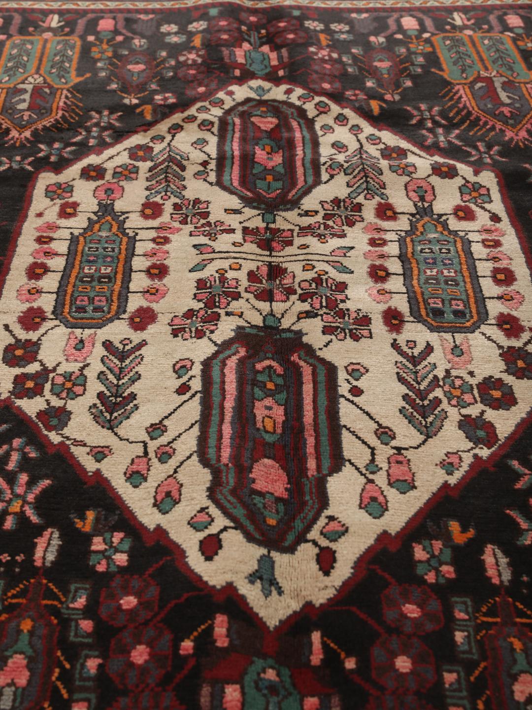 Hand-knotted Afshar rug from the Middle East featuring a dark-red and cream geometric design