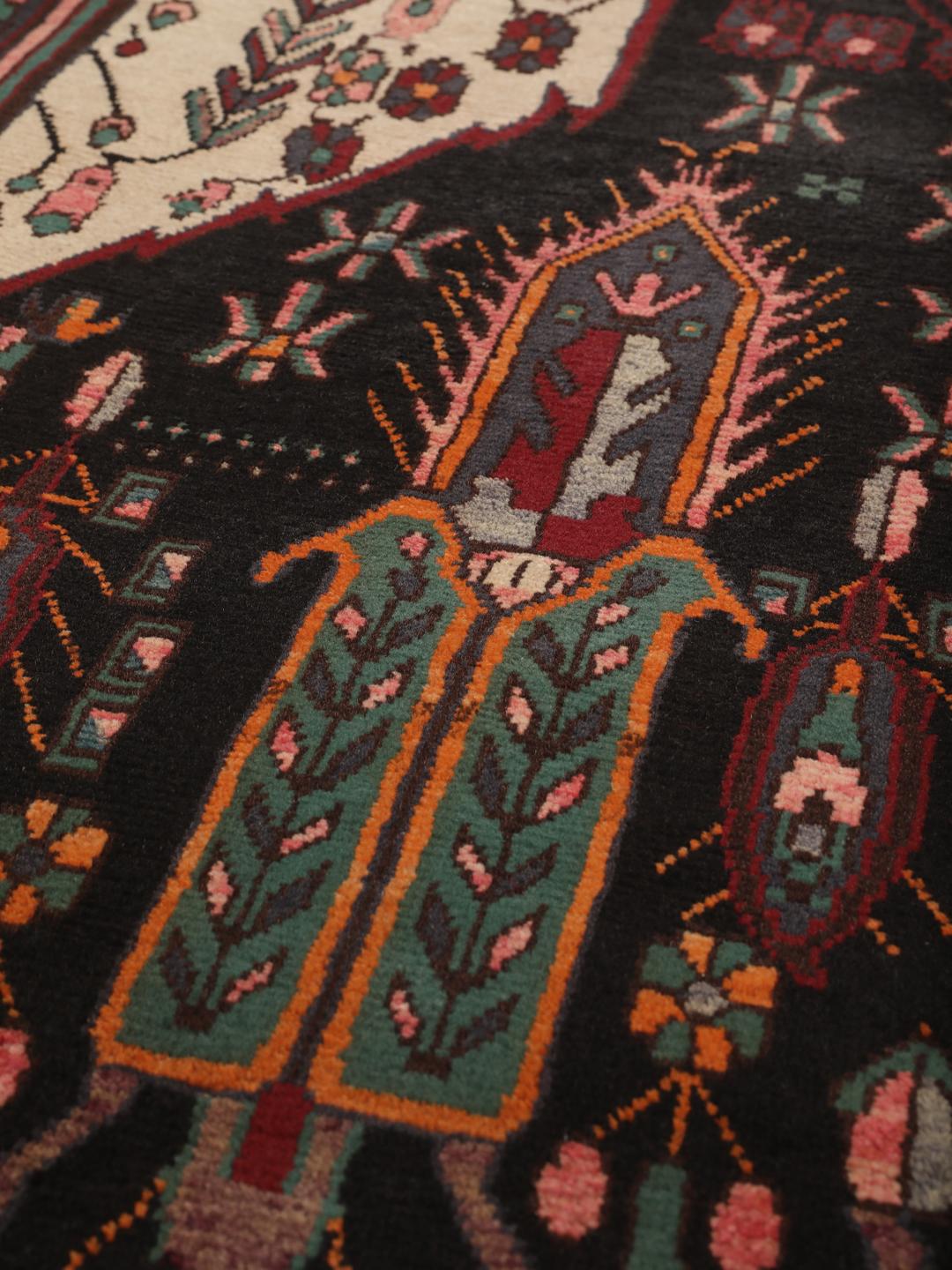 Hand-knotted Afshar rug from the Middle East featuring a dark-red and cream geometric design