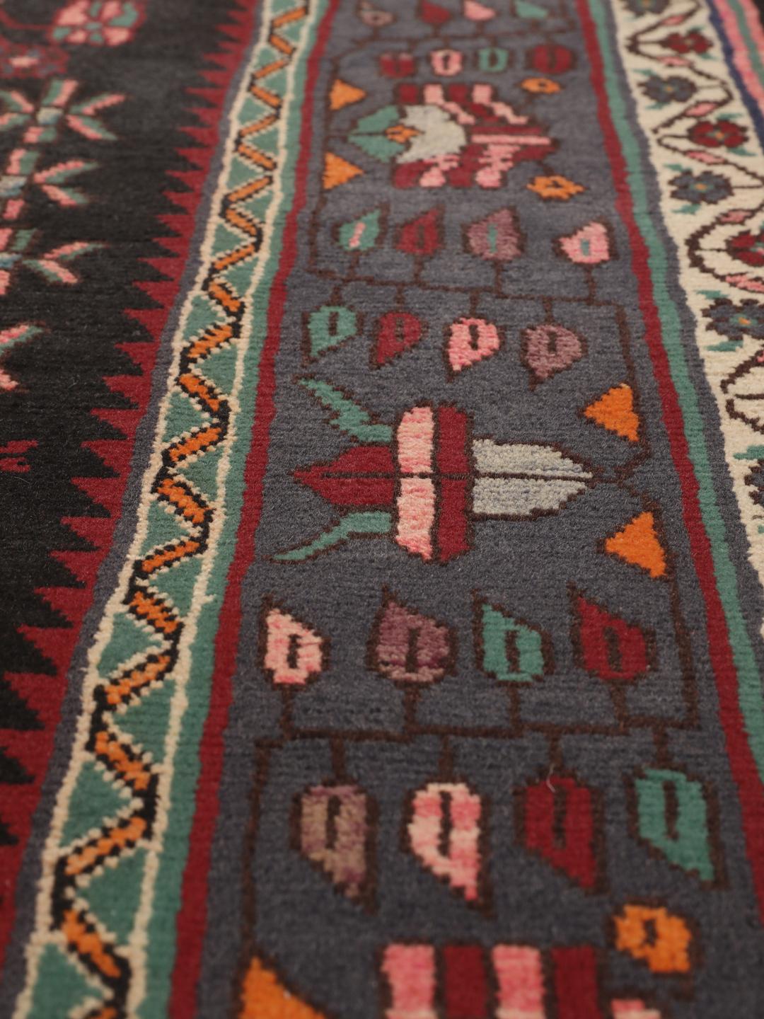 Hand-knotted Afshar rug from the Middle East featuring a dark-red and cream geometric design
