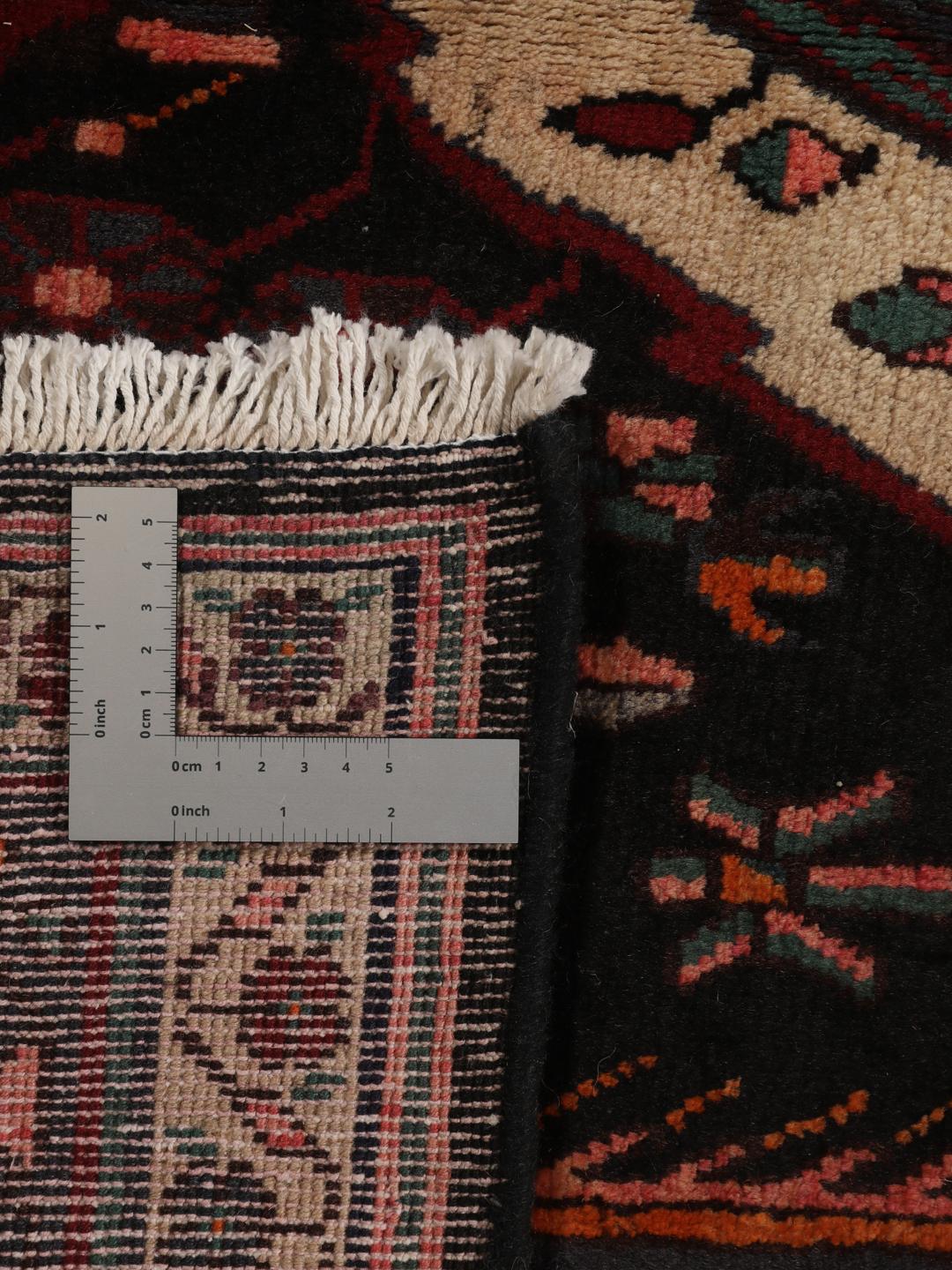 Hand-knotted Afshar rug from the Middle East featuring a dark-red and cream geometric design