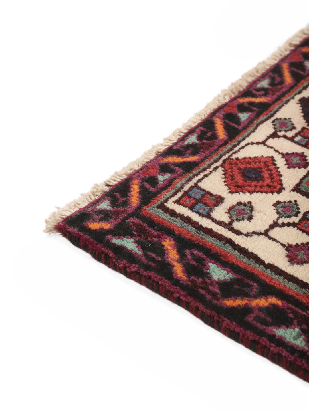 Hand-knotted Afshar rug from the Middle East in red with geometric patterns