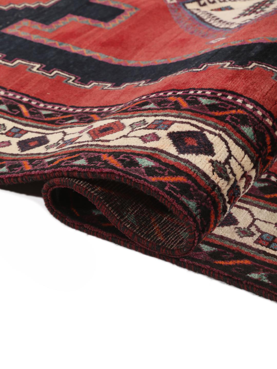 Hand-knotted Afshar rug from the Middle East in red with geometric patterns