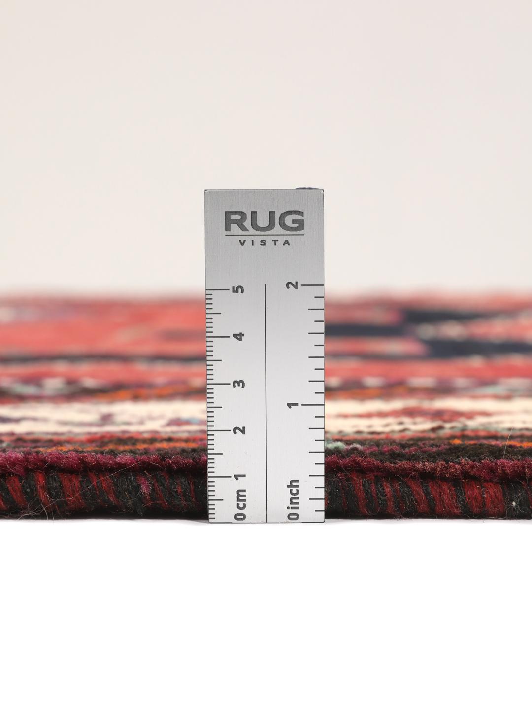 Hand-knotted Afshar rug from the Middle East in red with geometric patterns