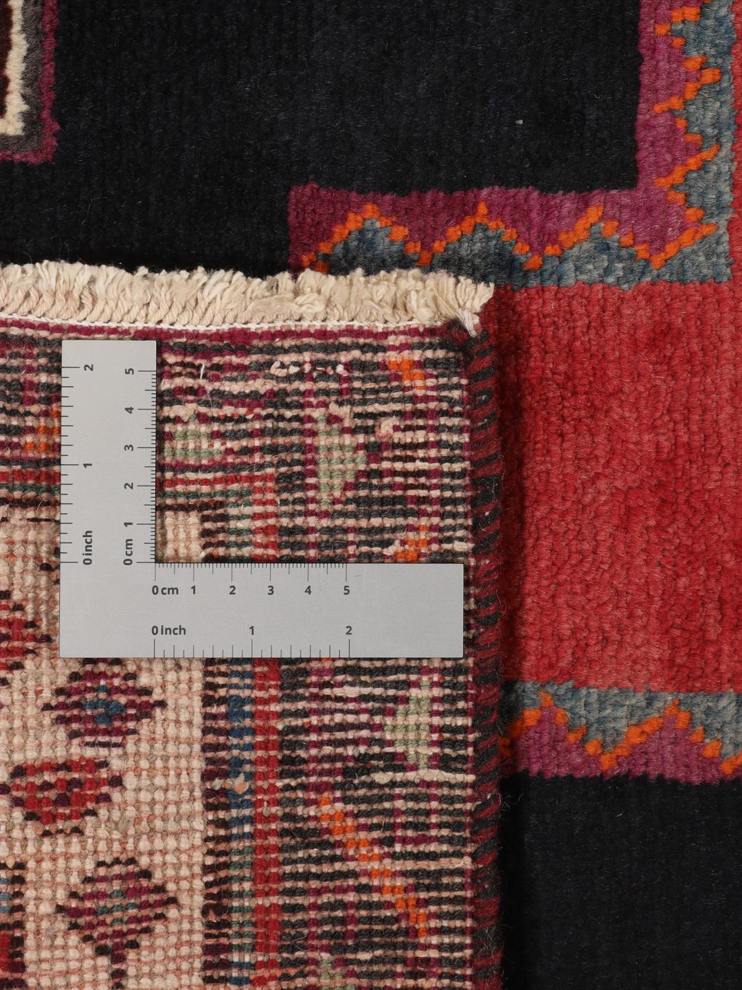 Hand-knotted Afshar rug from the Middle East in red with geometric patterns