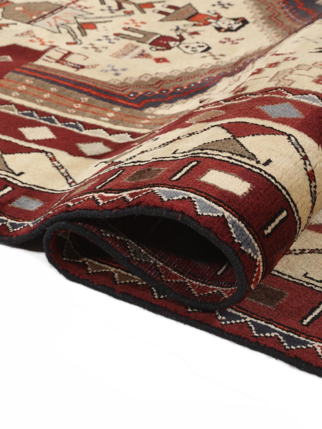 Hand-knotted Afshar rug from the Middle East in red and cream featuring pictorial motifs