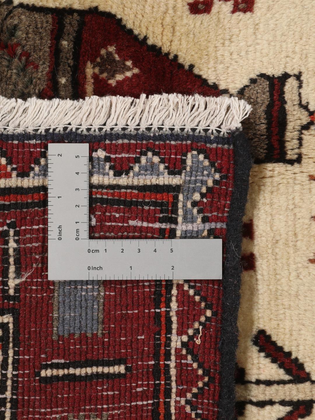 Hand-knotted Afshar rug from the Middle East in red and cream featuring pictorial motifs